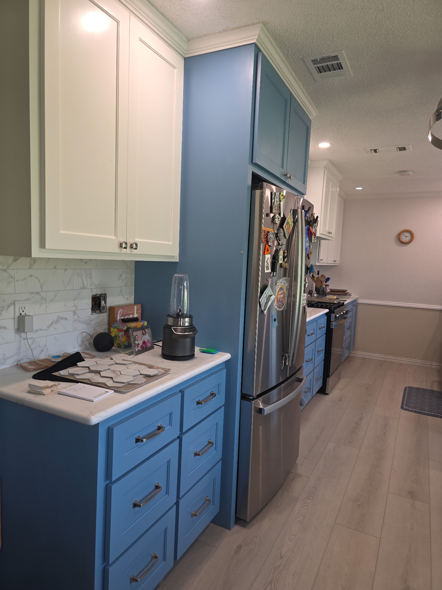 Two-tone blue and white kitchen cabinetry